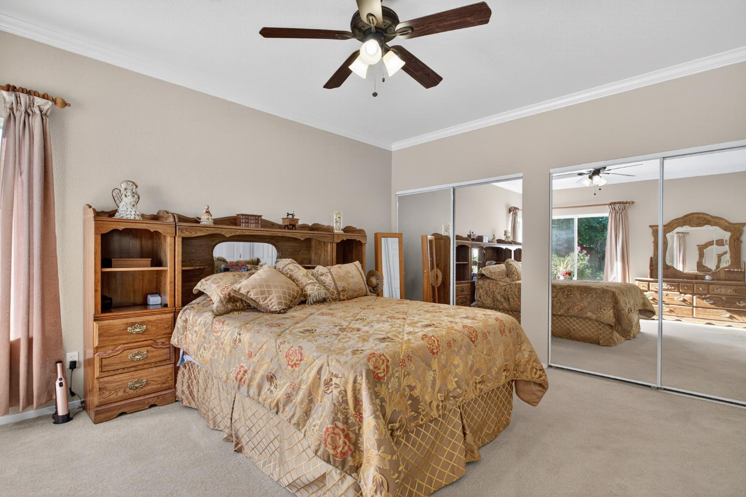 3200 Spring Garden Drive Turlock, CA 95382 - Photo 17 of 30 a bedroom with a bed and ceiling fan