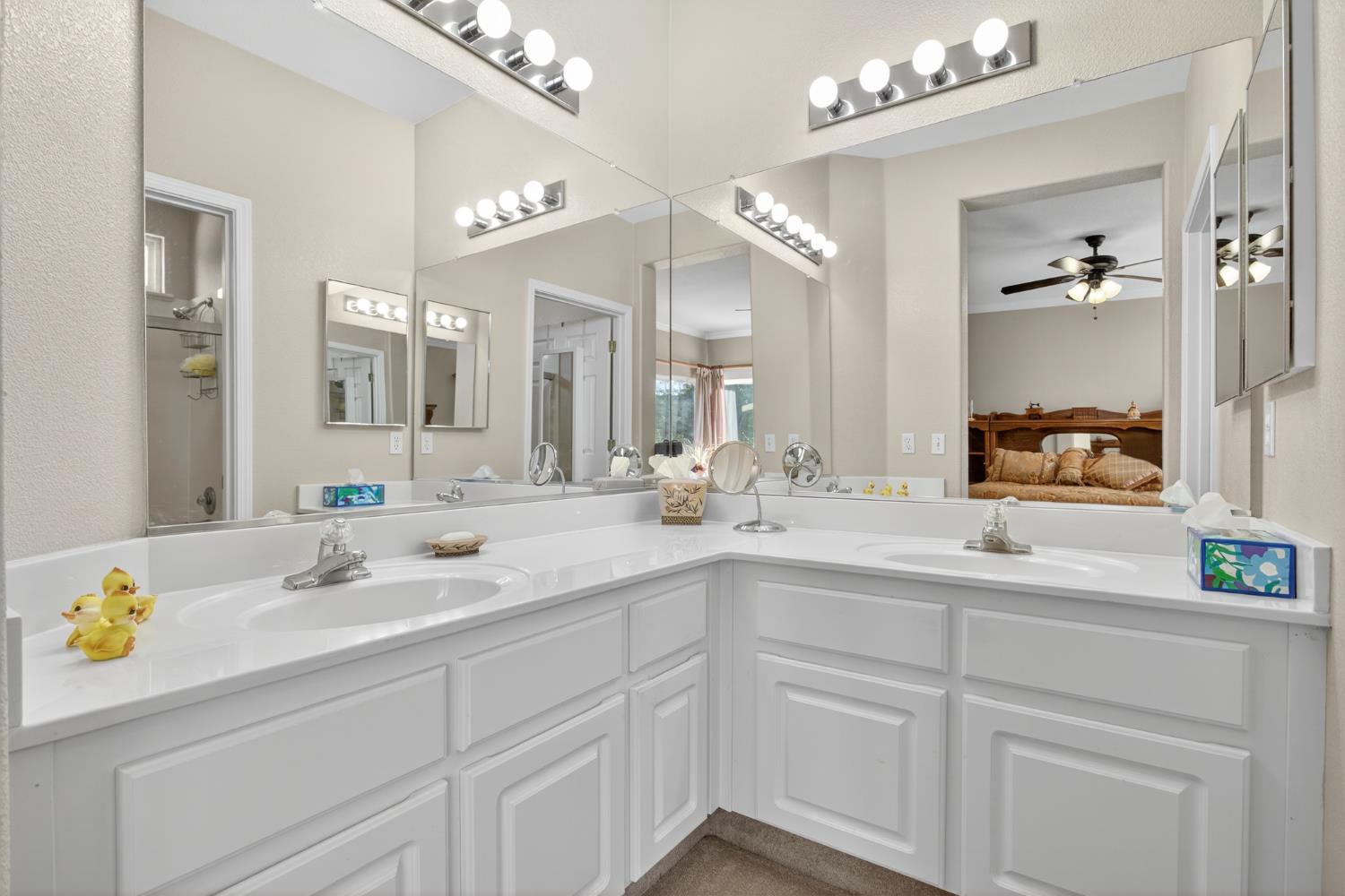 3200 Spring Garden Drive Turlock, CA 95382 - Photo 19 of 30 a bathroom with a sink double vanity granite and a mirror