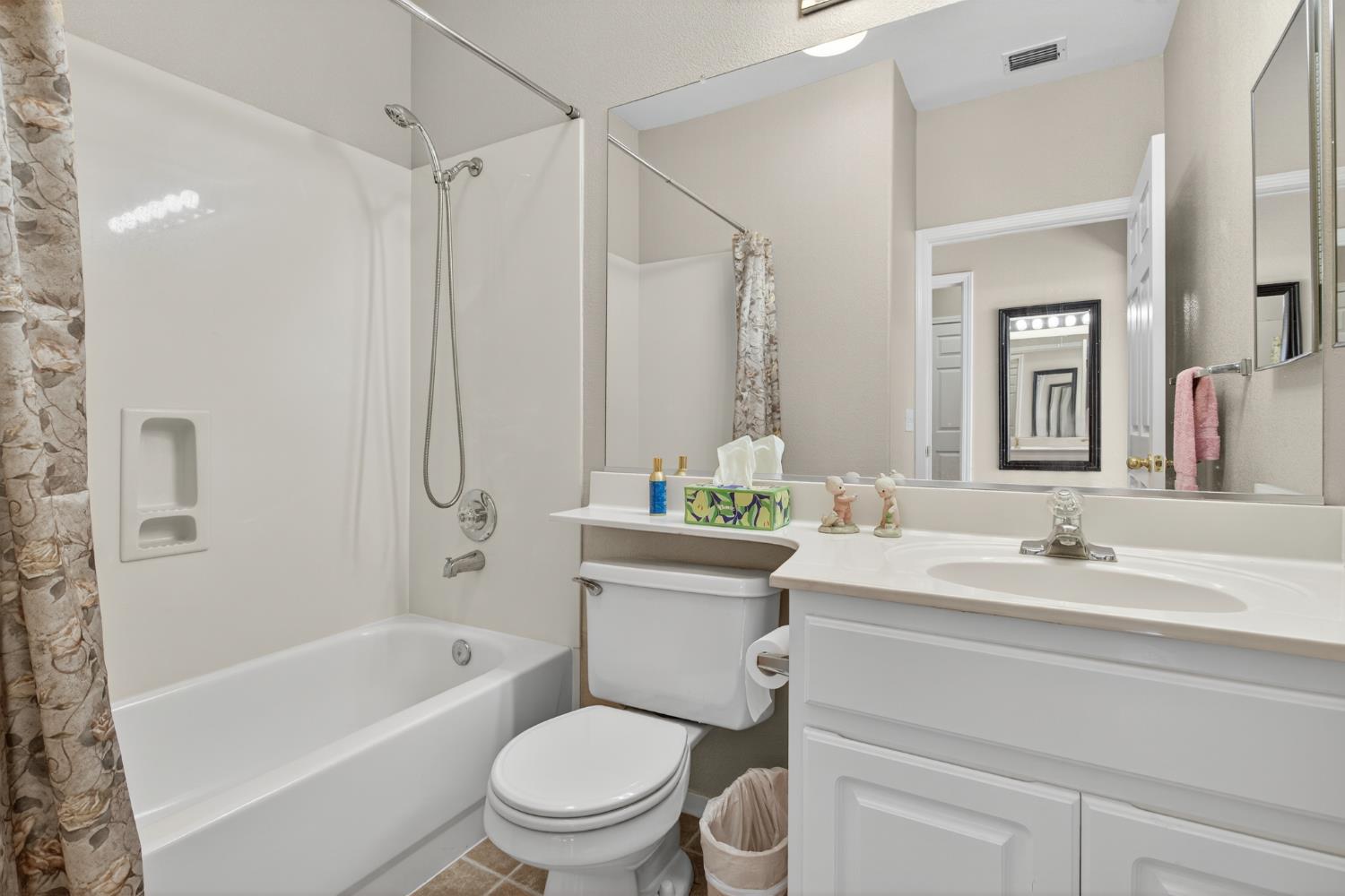3200 Spring Garden Drive Turlock, CA 95382 - Photo 23 of 30 a bathroom with a sink toilet vanity tub and shower