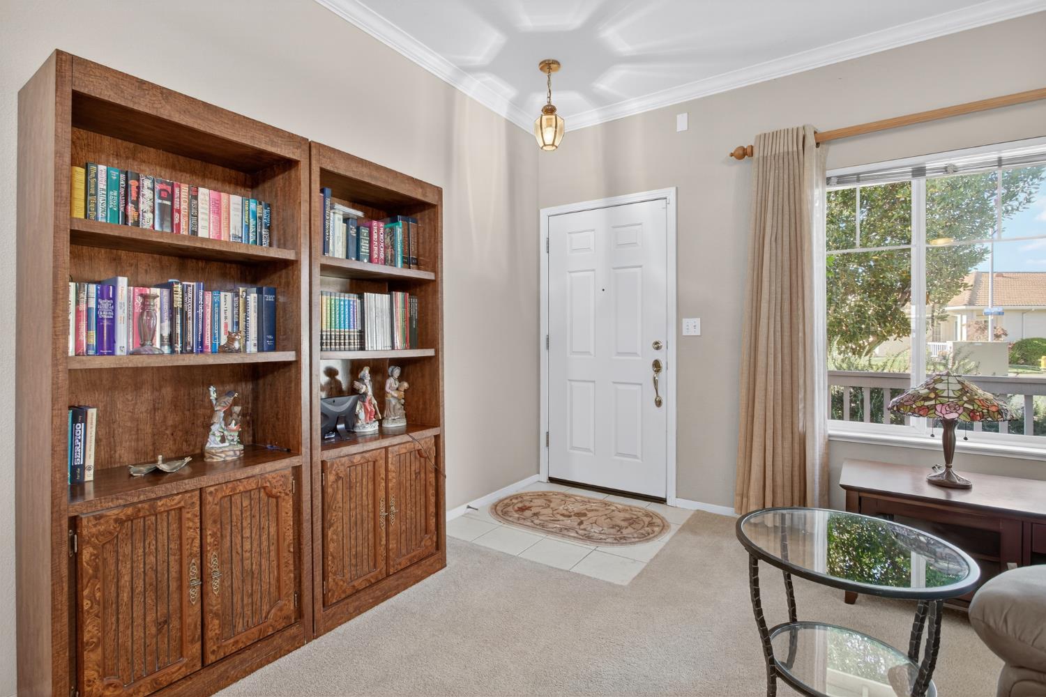 3200 Spring Garden Drive Turlock, CA 95382 - Photo 5 of 30 a living room with furniture a bookshelf and a window