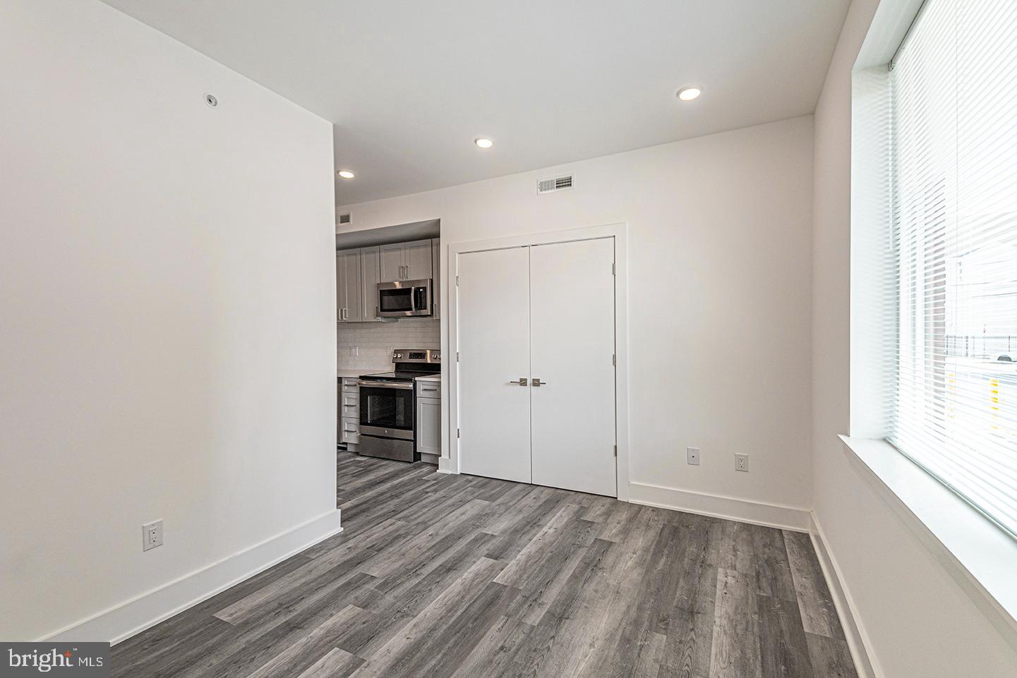 1245 Ridge Avenue, Unit 103 Philadelphia, PA 19123 - Photo 15 of 18 a view of a kitchen with wooden floor and a window