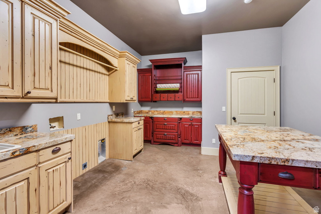 811 South High Ridge Drive Alpine, UT 84004 - Photo 55 of 98 Kitchen with concrete floors, open shelves, and two tone color scheme