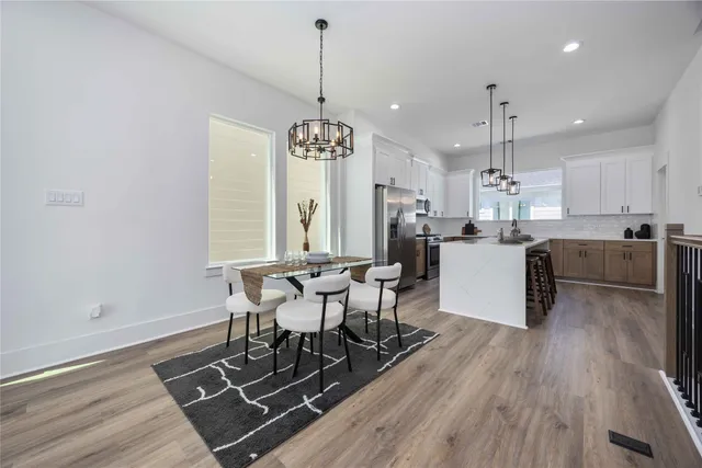 a view of a dining room with furniture window and wooden floor