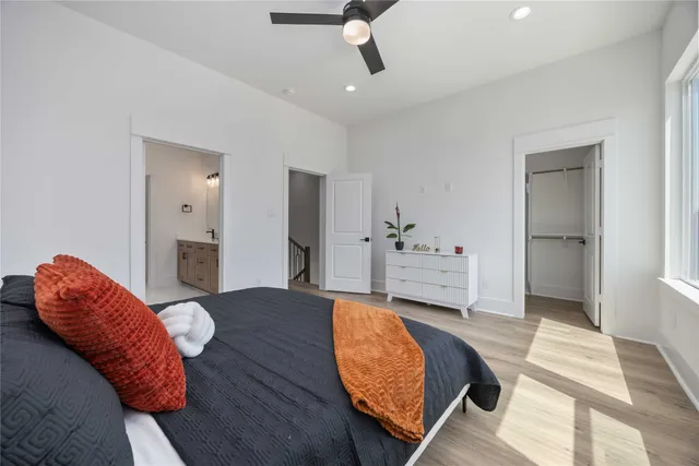 a bedroom with a bed and a couch