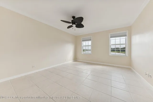 a view of a patio with a table and chairs under an umbrella