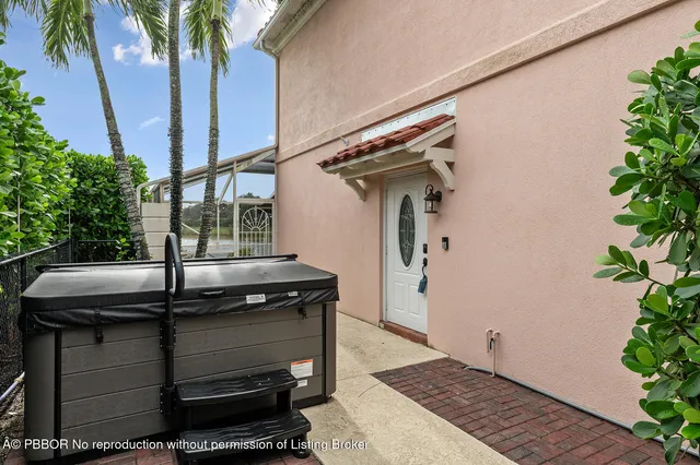 an aerial view of a house with a garden and swimming pool