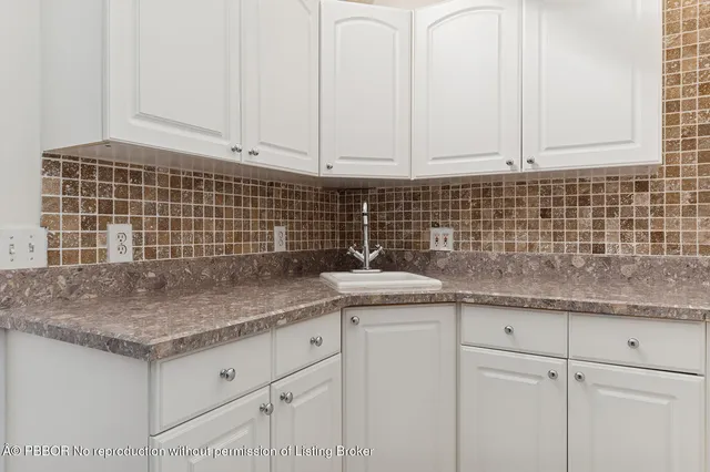 a view of a livingroom with furniture and a livingroom