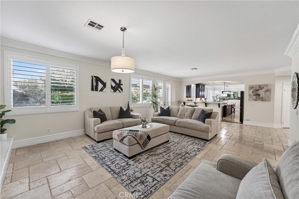 2634 Old Windmill Court Riverside, CA 92503 - Photo 13 of 44 a living room with furniture and a chandelier