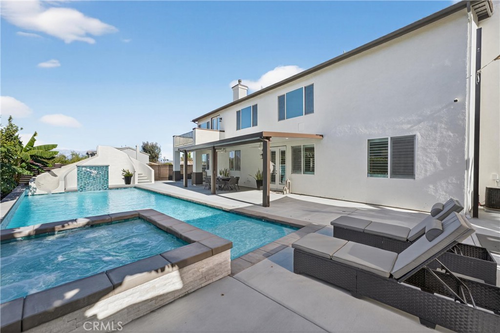 2634 Old Windmill Court Riverside, CA 92503 - Photo 3 of 44 a view of a house with pool and chairs
