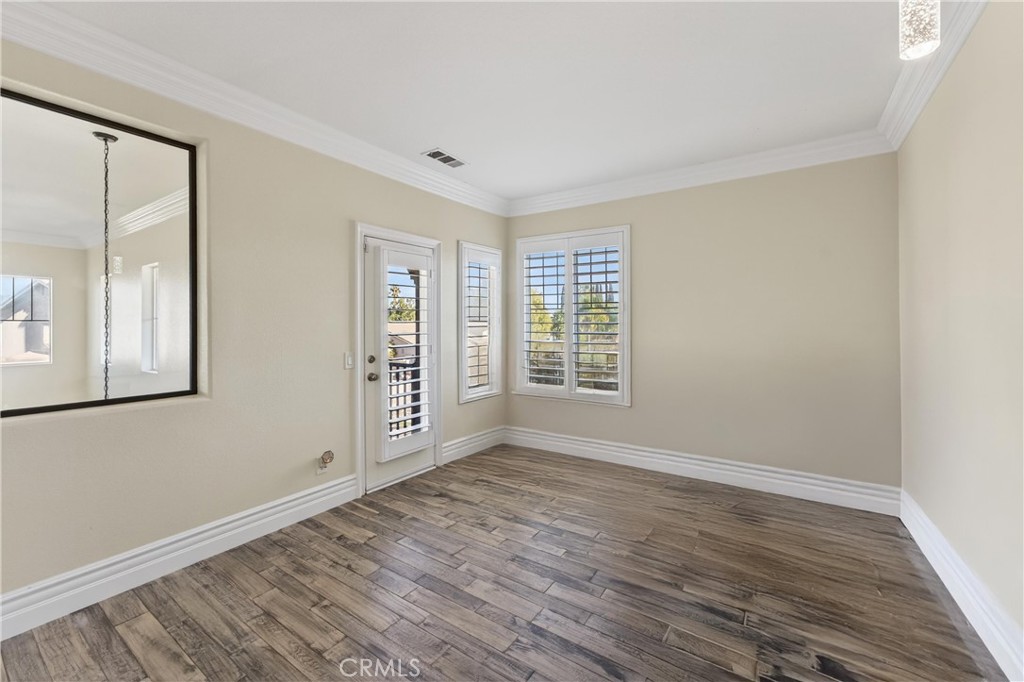 2634 Old Windmill Court Riverside, CA 92503 - Photo 38 of 44 a view of an empty room with wooden floor and a window