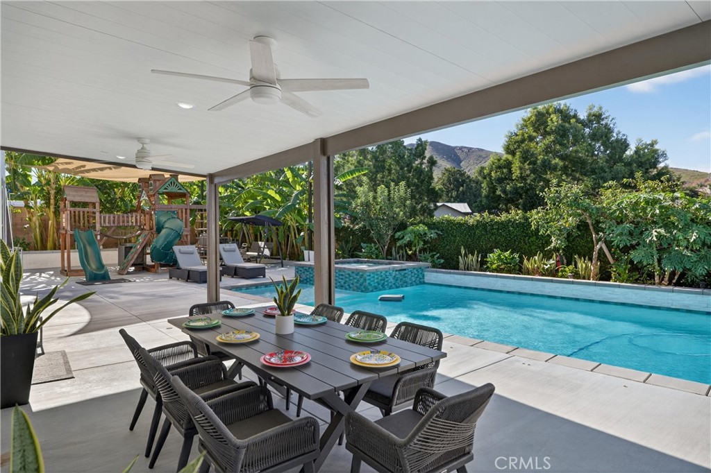 2634 Old Windmill Court Riverside, CA 92503 - Photo 44 of 44 a view of a patio with a table chairs and a backyard