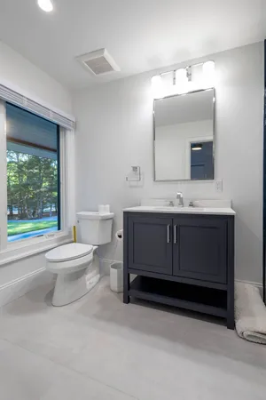 a bathroom with a sink toilet and shower