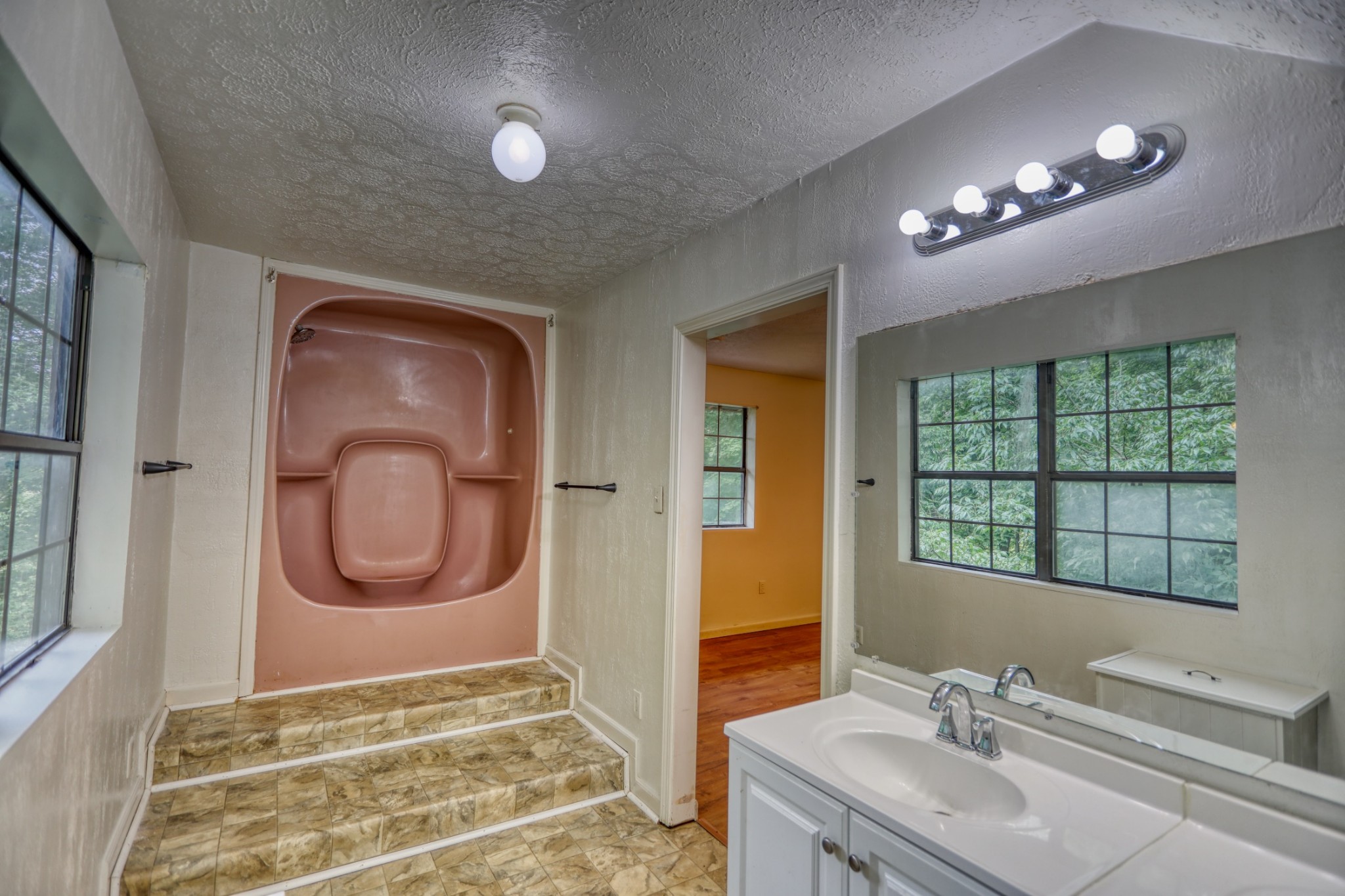 214 West Harper Road Portland, TN 37148 - Photo 11 of 28 a bathroom with a sink and a mirror
