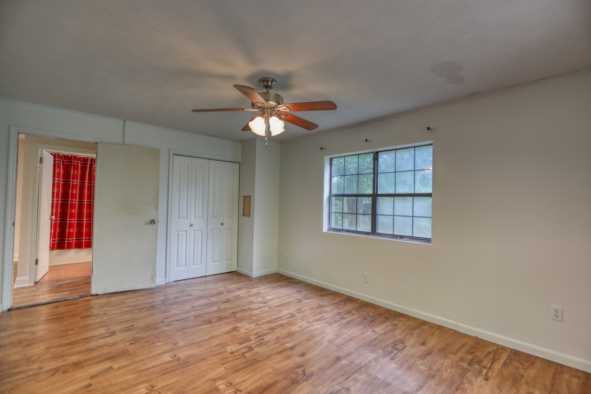 214 West Harper Road Portland, TN 37148 - Photo 14 of 28 wooden floor in an empty room with a window