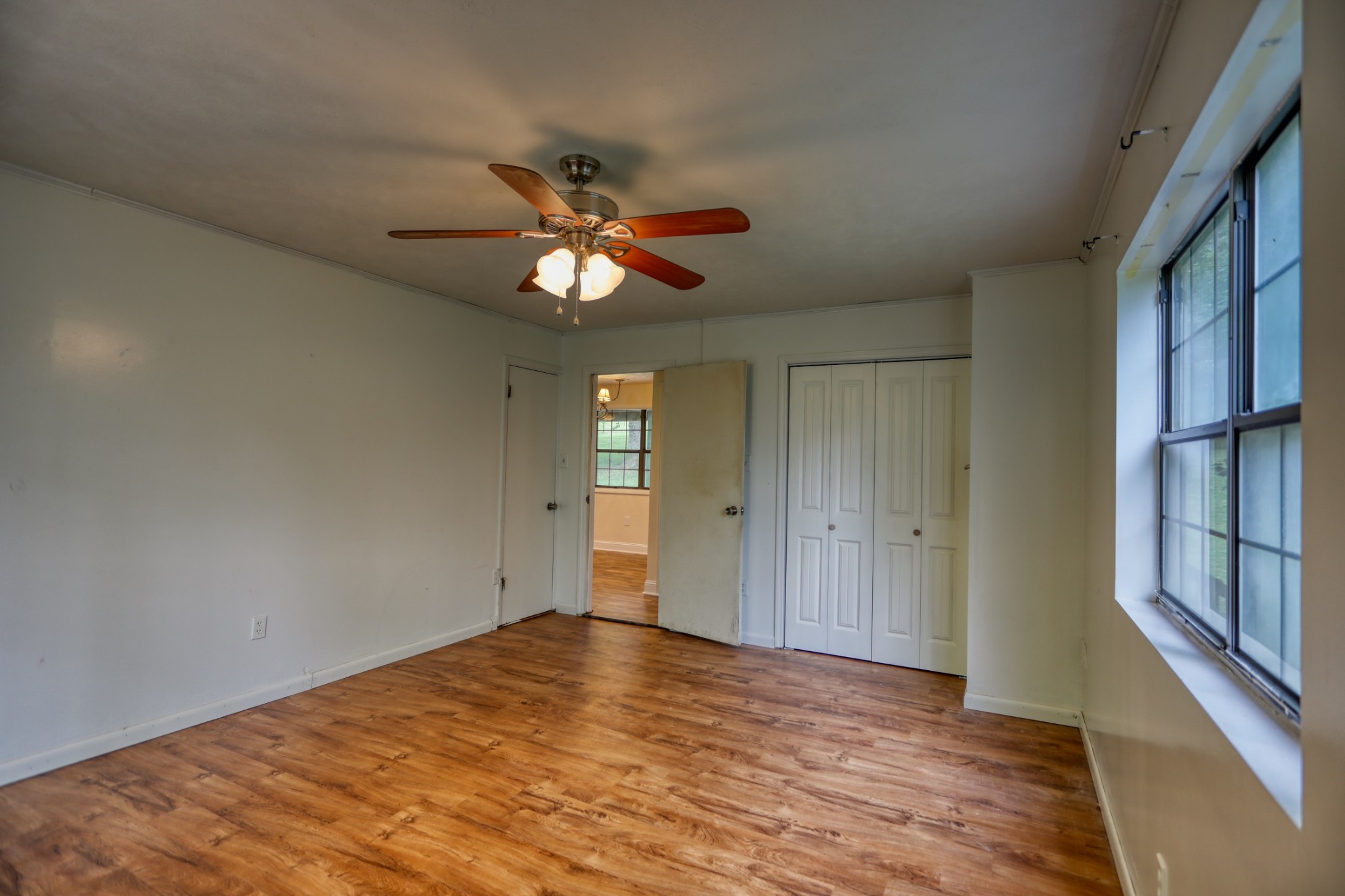 214 West Harper Road Portland, TN 37148 - Photo 15 of 28 wooden floor in an empty room with a window