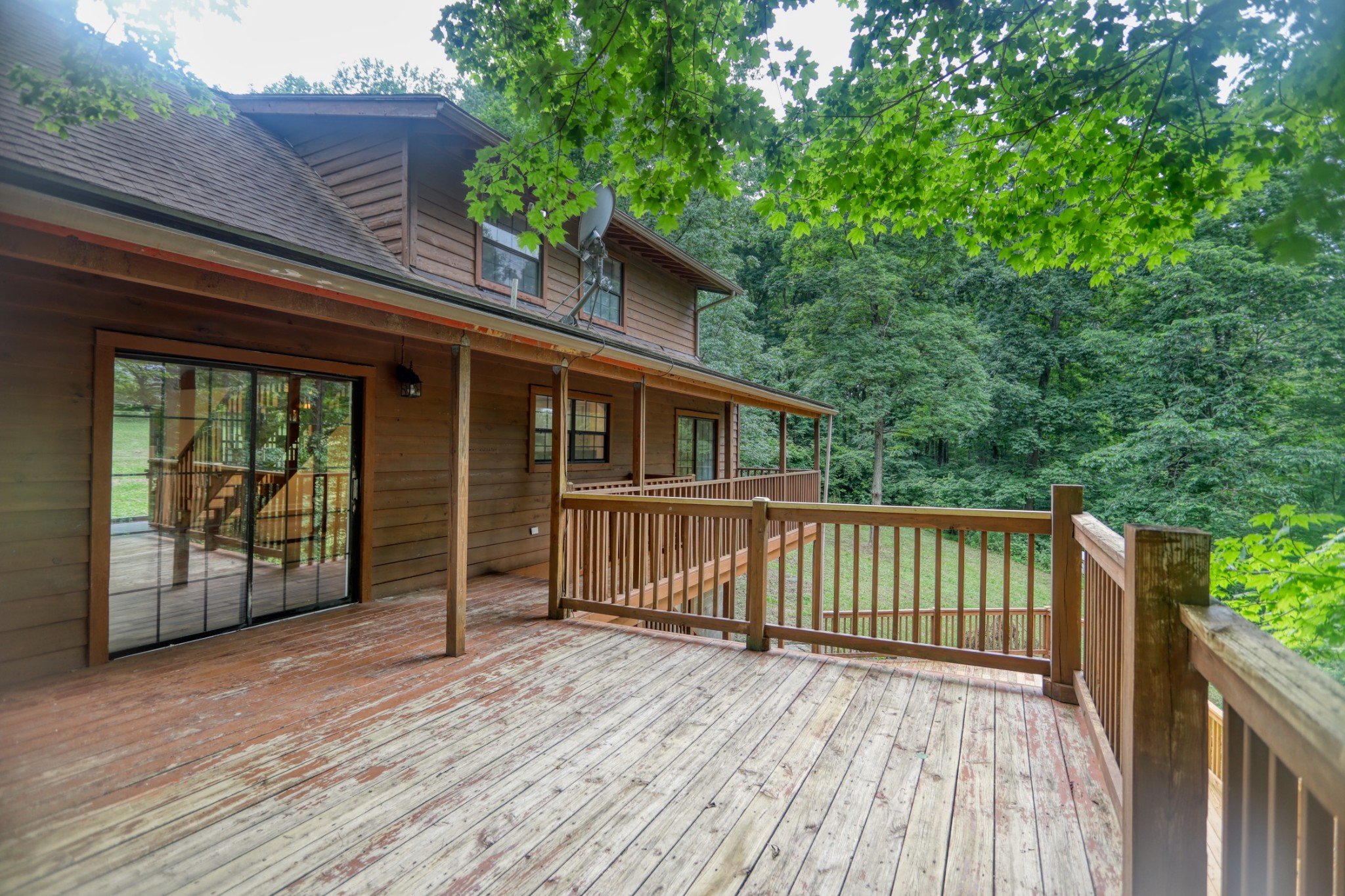 214 West Harper Road Portland, TN 37148 - Photo 7 of 28 a view of backyard with large trees and wooden fence