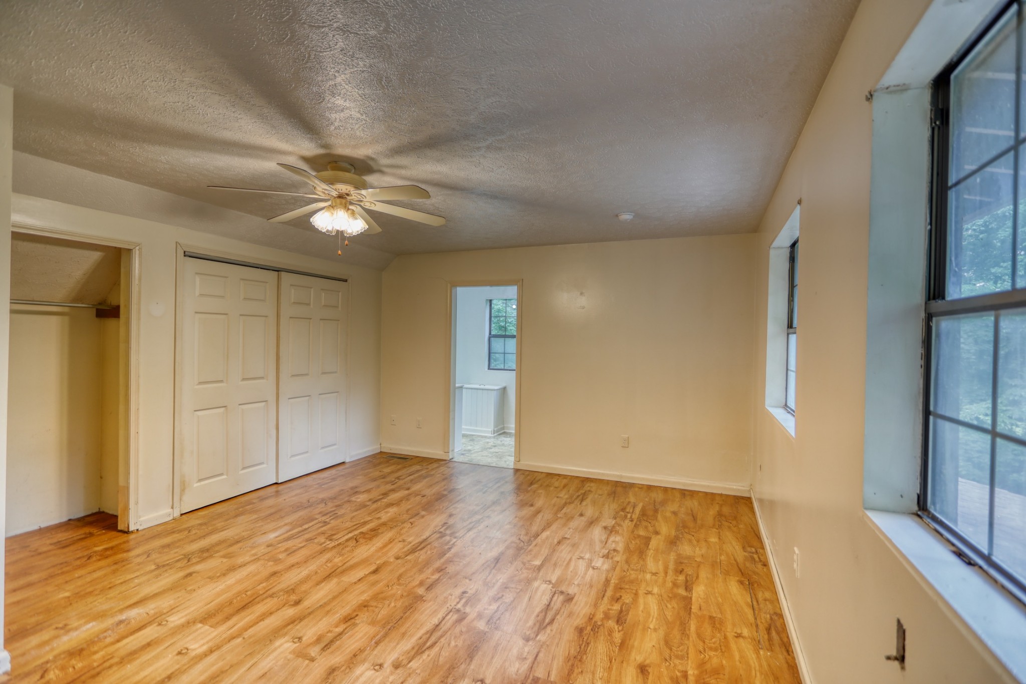 214 West Harper Road Portland, TN 37148 - Photo 8 of 28 wooden floor in an empty room with a window