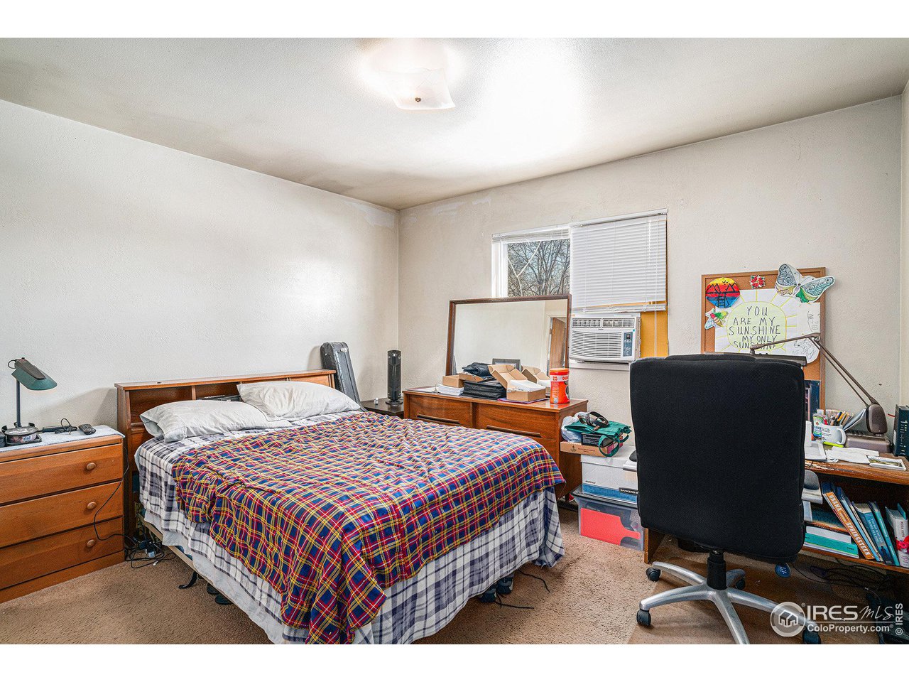 1031 Castlerock Drive Fort Collins, CO 80521 - Photo 12 of 15 a bedroom with a bed and a desk