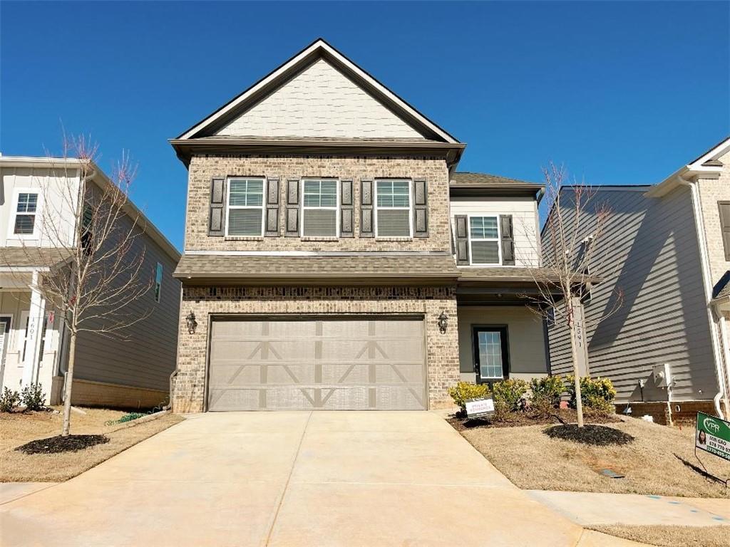 1591 Winding Rdg Trail Auburn, GA 30011 - Photo 1 of 1 a front view of a house with yard