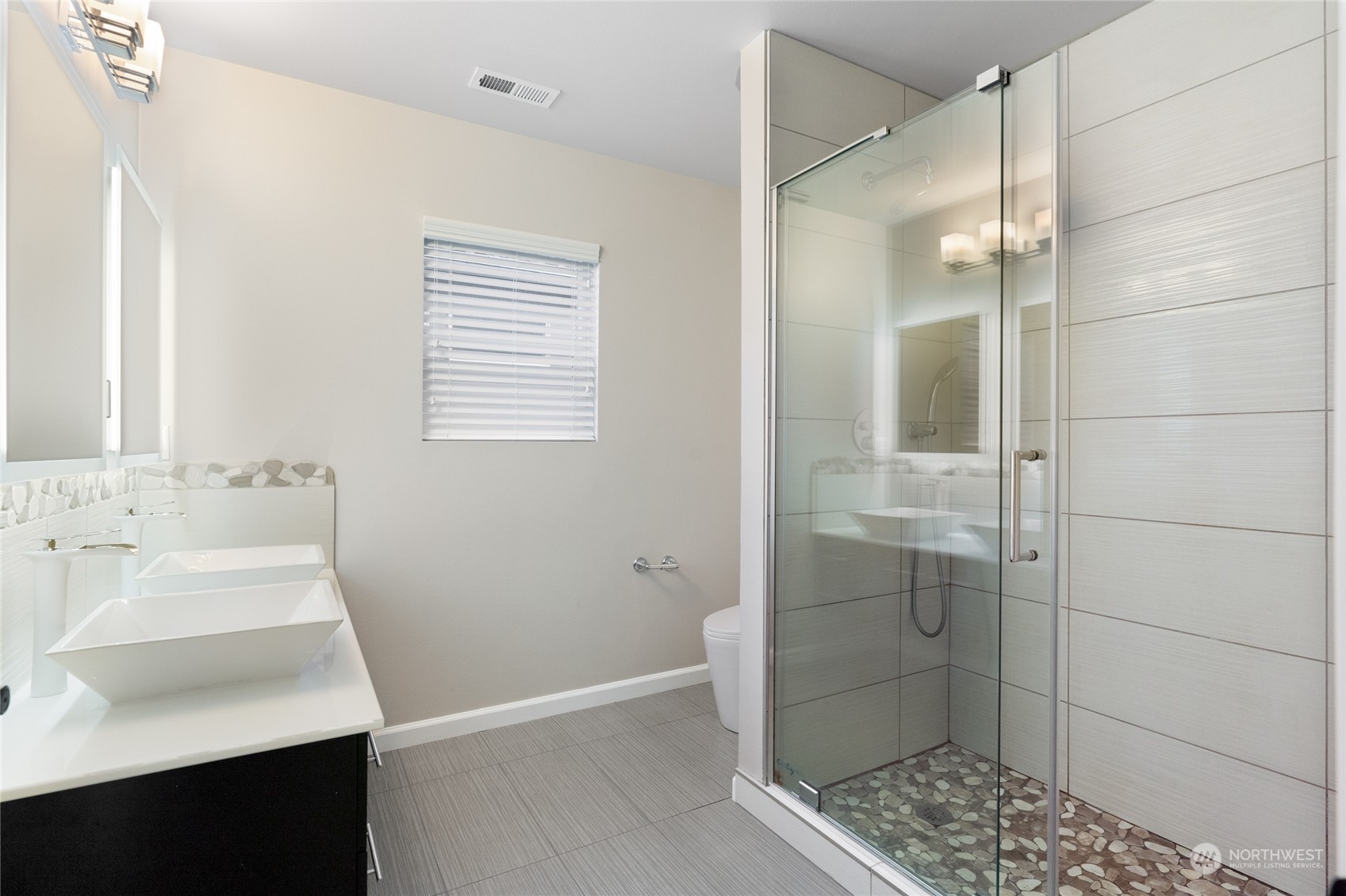 17914 46th Drive Southeast Bothell, WA 98012 - Photo 19 of 38 a bathroom with a sink and shower