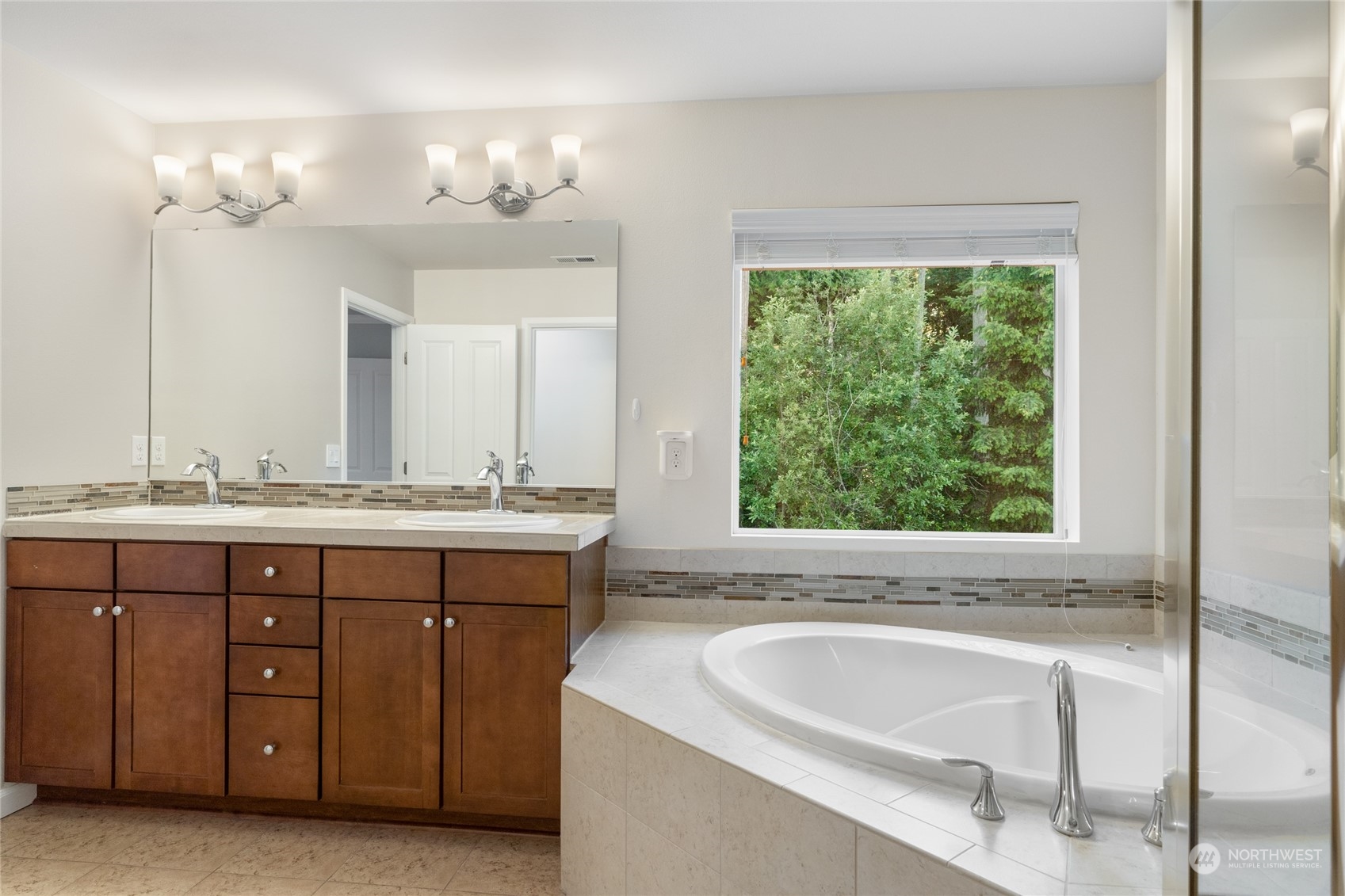 17914 46th Drive Southeast Bothell, WA 98012 - Photo 25 of 38 a bathroom with a tub a sink and a window