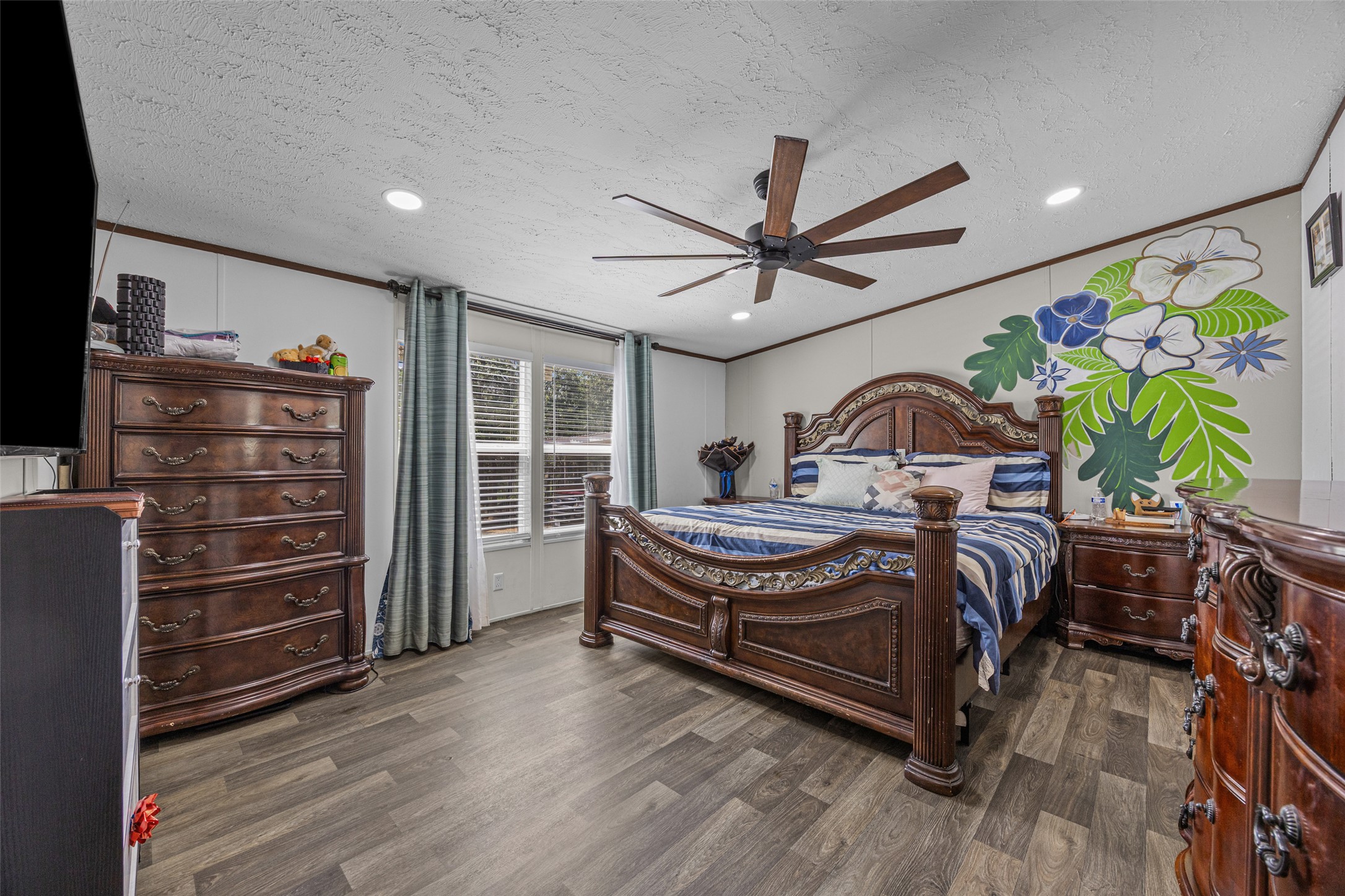 564 Boyd Road Red Rock, TX 78662 - Photo 16 of 25 Comfortable bedroom features ample natural light and recessed lighting, with a large fan for optimal airflow.