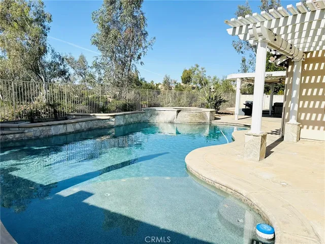 a view of swimming pool from a lounge chair