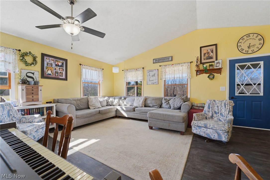 2932 Sexton Road Geneva, OH 44041 - Photo 21 of 41 Living room with vaulted ceiling, a ceiling fan, and wood finished floors