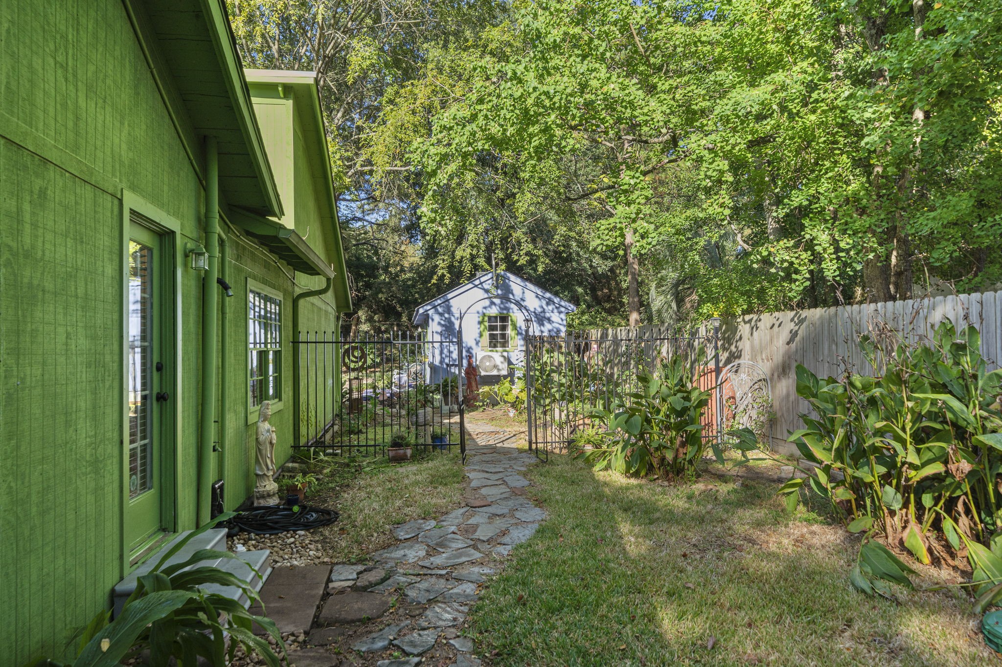 18162 Atkinson Lane Conroe, TX 77384 - Photo 3 of 50 a backyard of a house with lots of green space