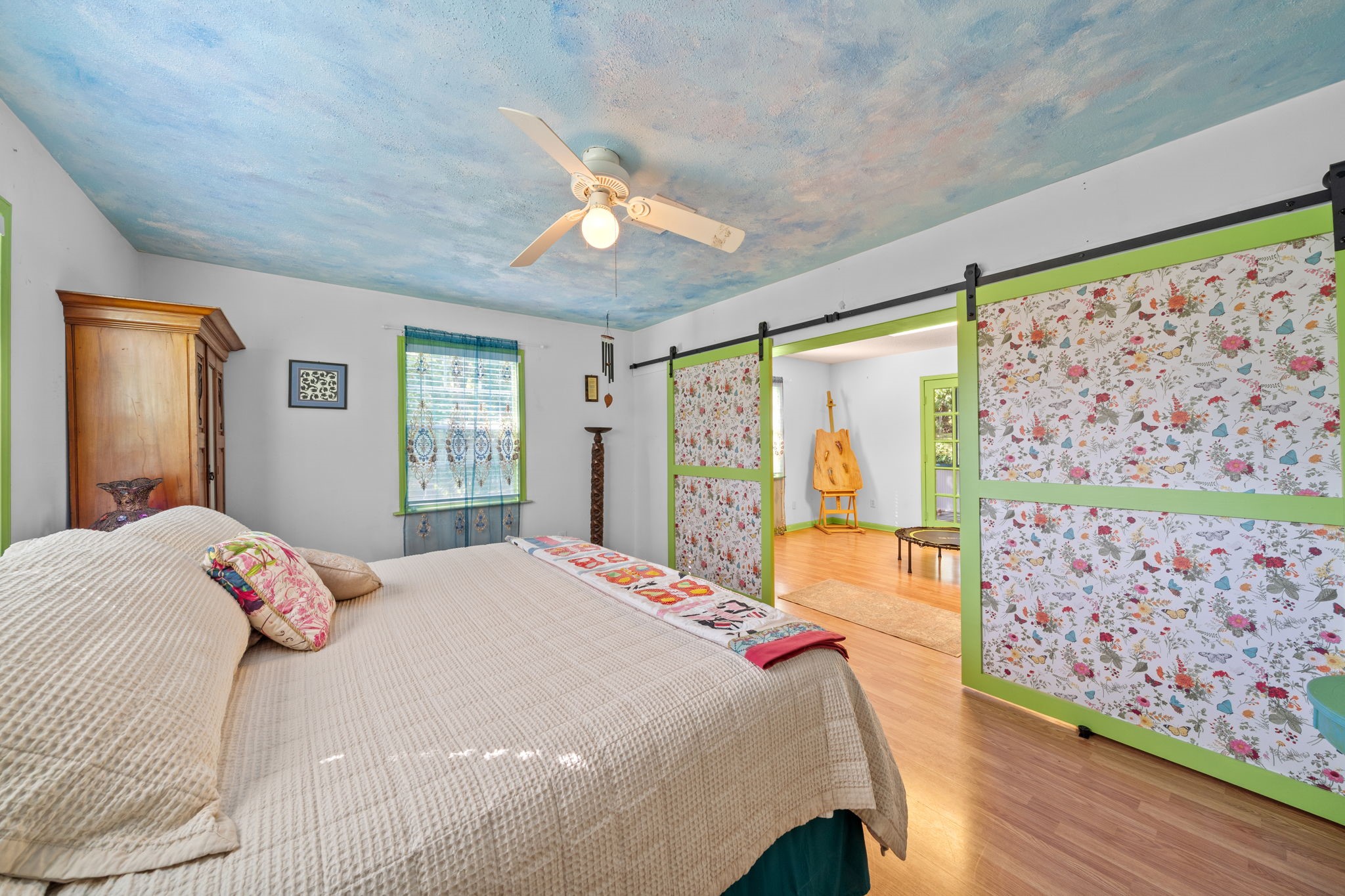 18162 Atkinson Lane Conroe, TX 77384 - Photo 30 of 50 a bedroom with a large bed and a large window