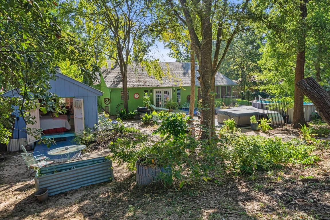 18162 Atkinson Lane Conroe, TX 77384 - Photo 34 of 50 AirBnb with double barn doors open to nature.