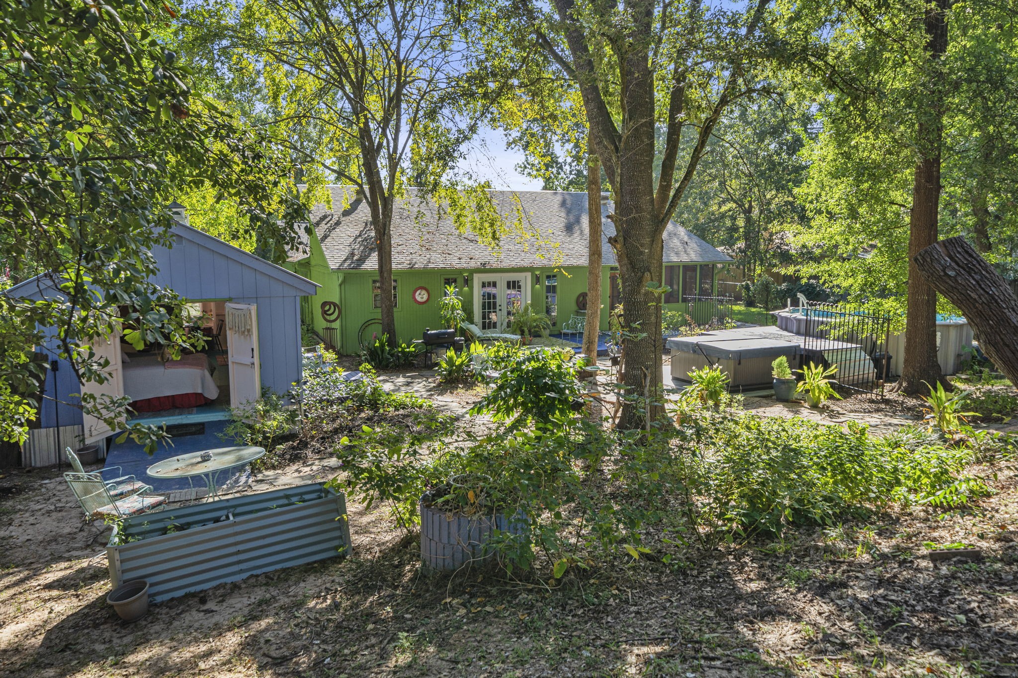 18162 Atkinson Lane Conroe, TX 77384 - Photo 39 of 50 a front view of a house with garden