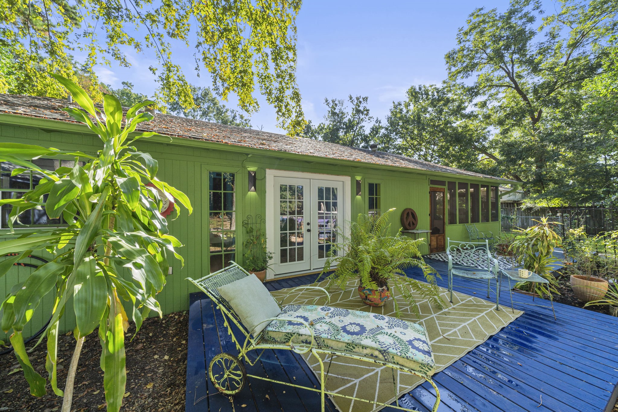 18162 Atkinson Lane Conroe, TX 77384 - Photo 4 of 50 a view of backyard with table and chairs potted plants and wooden fence