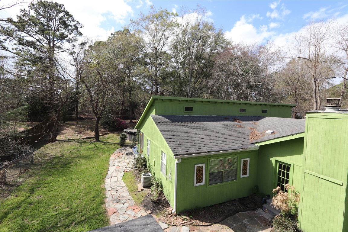 18162 Atkinson Lane Conroe, TX 77384 - Photo 49 of 50 Beautiful flagstone walking paths surround property