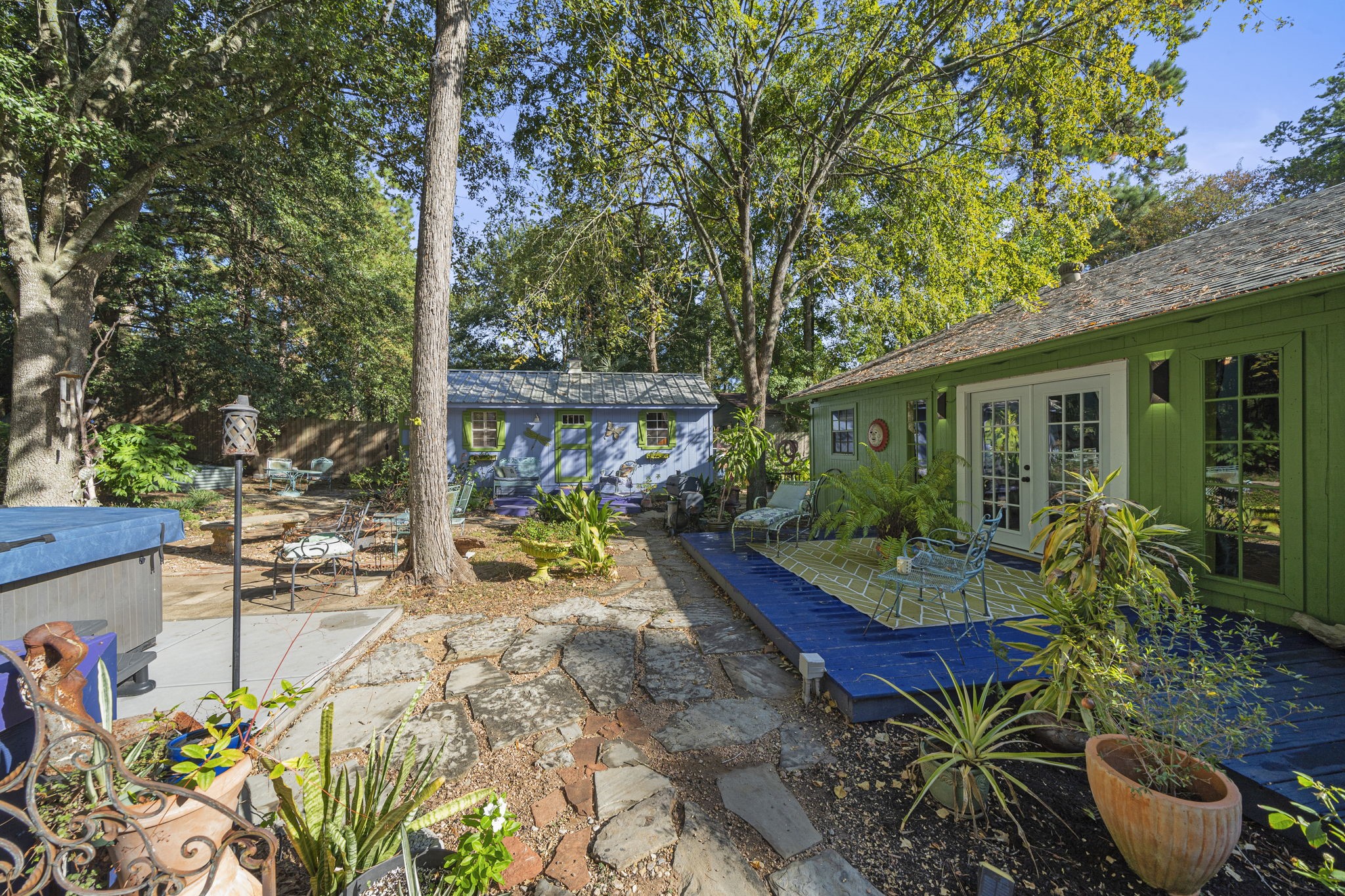18162 Atkinson Lane Conroe, TX 77384 - Photo 7 of 50 a view of a chair and tables in the patio with a backyard