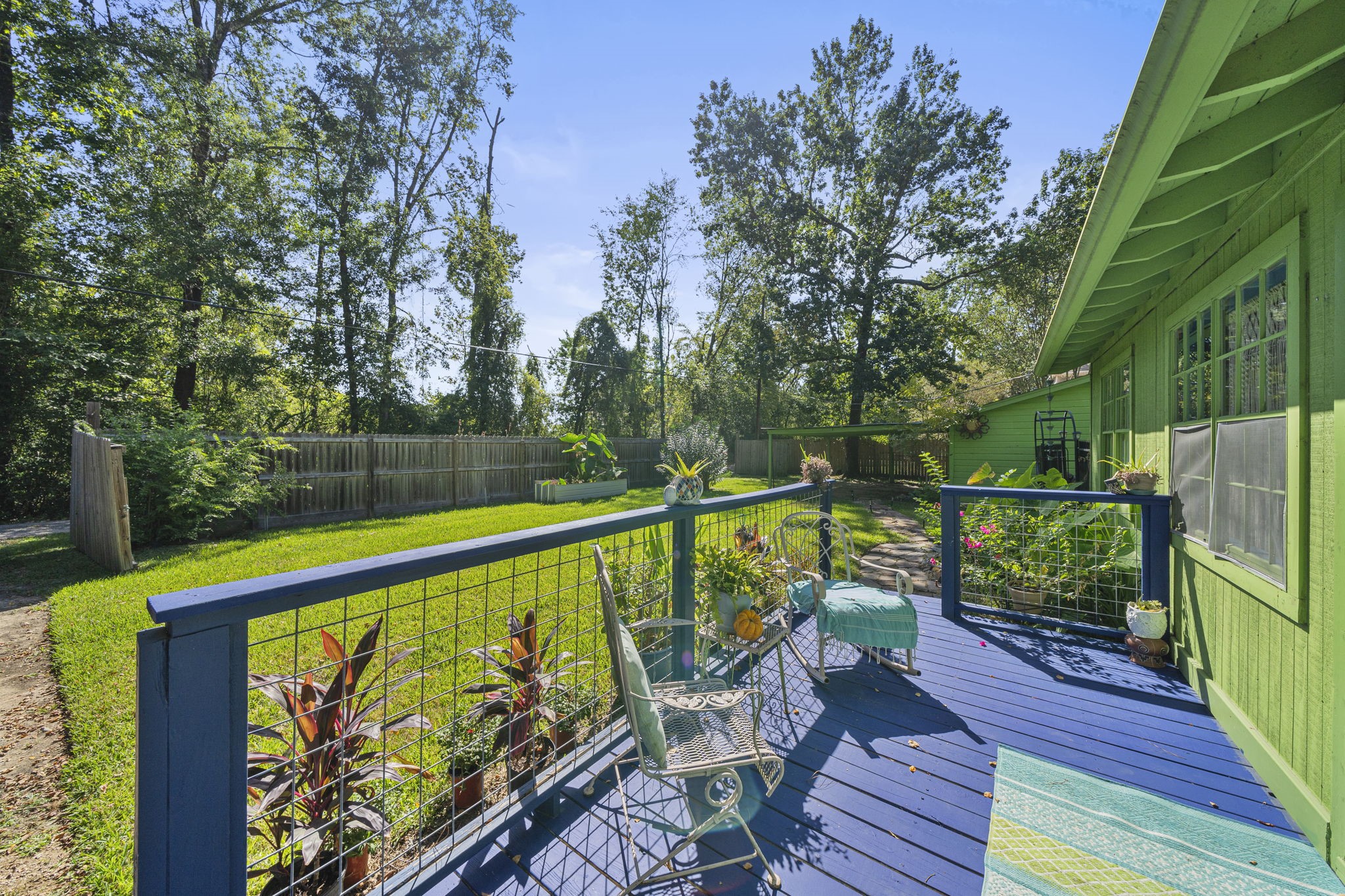 18162 Atkinson Lane Conroe, TX 77384 - Photo 8 of 50 a view of a deck with a large swimming pool
