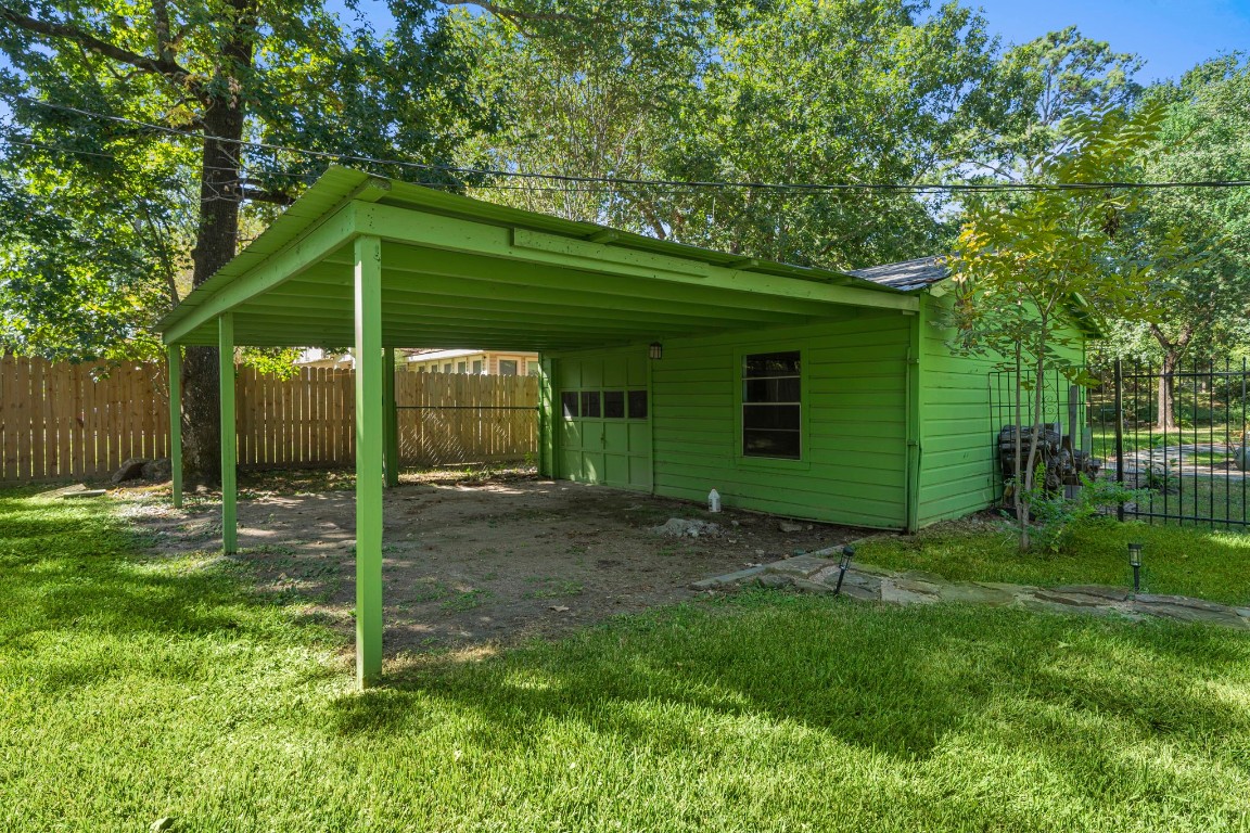 18162 Atkinson Lane Conroe, TX 77384 - Photo 9 of 50 Two Car garage w/ separate gated entrance; carport and storage rm in back