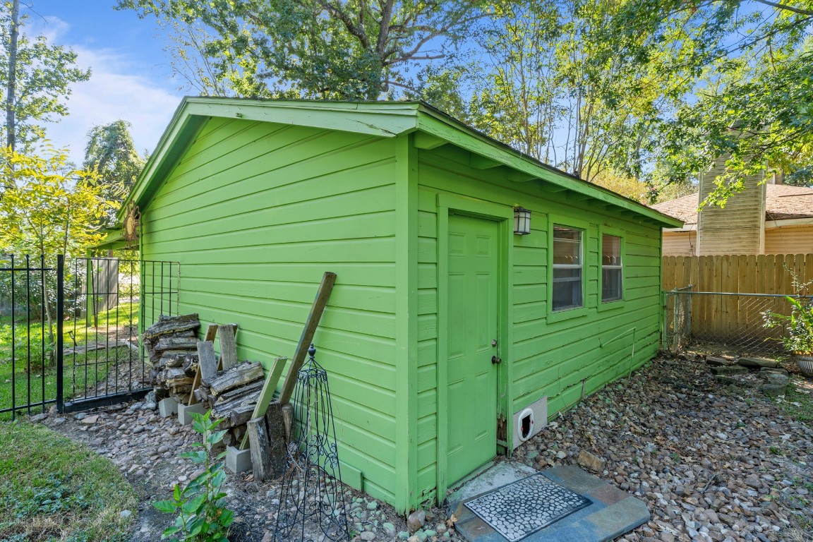 18162 Atkinson Lane Conroe, TX 77384 - Photo 10 of 50 Back of garage with separate access to storage/shop