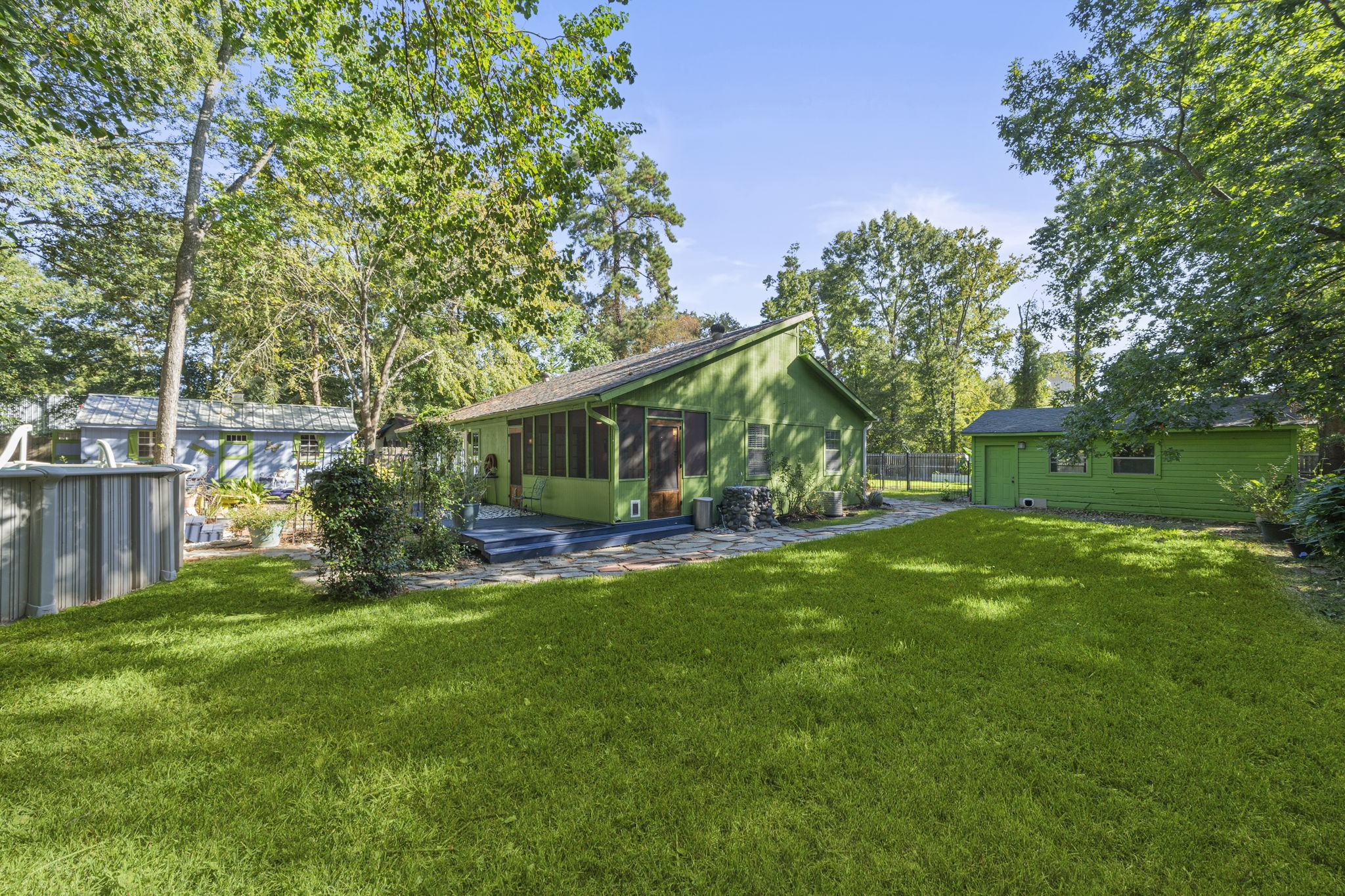 18162 Atkinson Lane Conroe, TX 77384 - Photo 10 of 50 a view of a house with a yard and sitting area