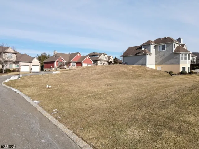a view of road with residential houses