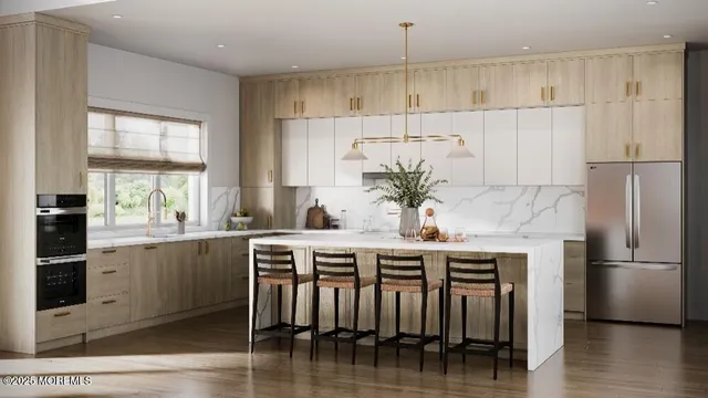 a kitchen with stainless steel appliances granite countertop a table chairs stove and refrigerator