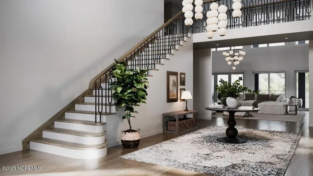 a living room with wooden floor and a potted plant