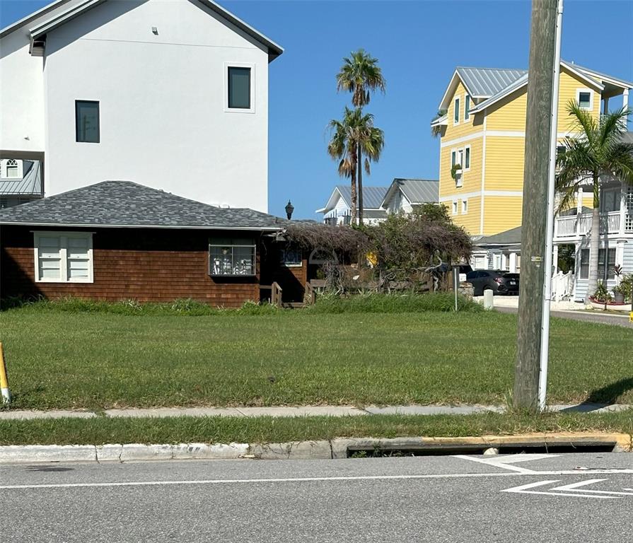 0 Gulf Boulevard Redington Shores, FL 33708 - Photo 4 of 21 a front view of a house with a garden