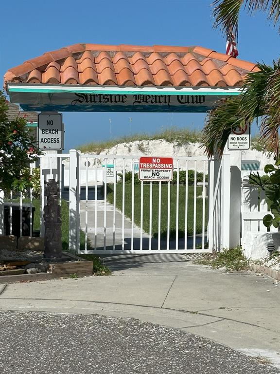 0 Gulf Boulevard Redington Shores, FL 33708 - Photo 7 of 21 a view of a brick house with a small yard and plants