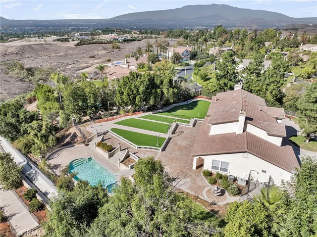an aerial view of a house with a garden
