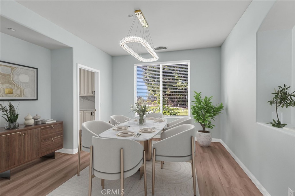7535 Misty View Place Riverside, CA 92506 - Photo 41 of 75 a view of a dining room with furniture window and wooden floor