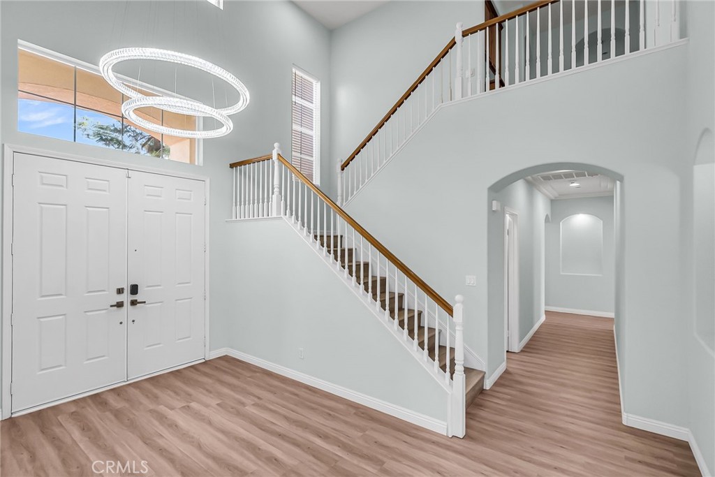 7535 Misty View Place Riverside, CA 92506 - Photo 45 of 75 a view of a hallway with wooden floor and staircase