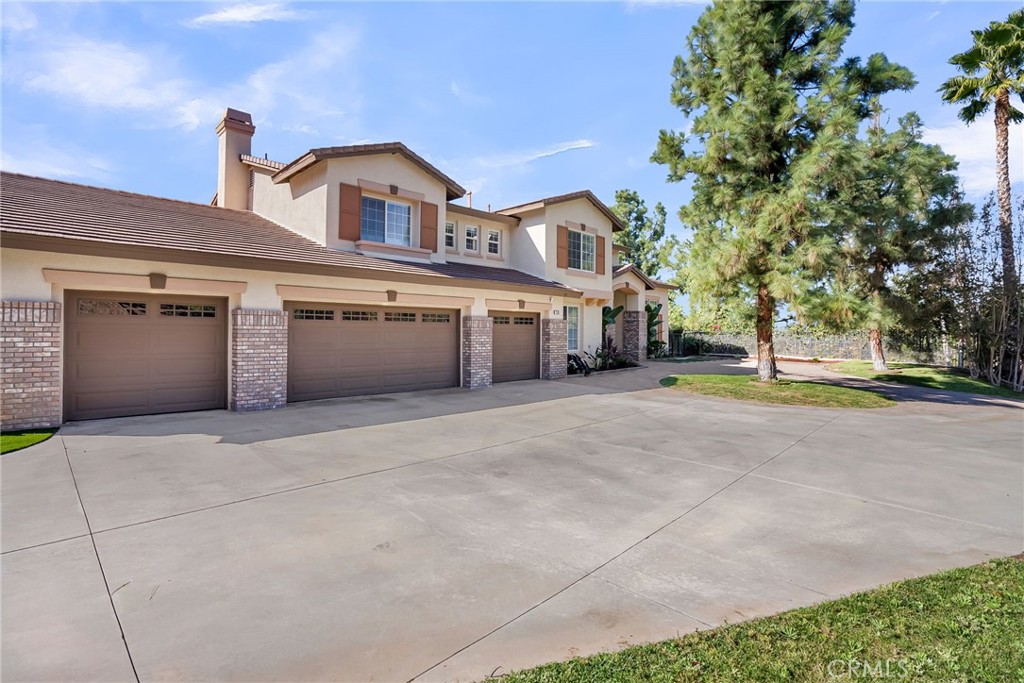 7535 Misty View Place Riverside, CA 92506 - Photo 59 of 75 a front view of a house with a yard and garage