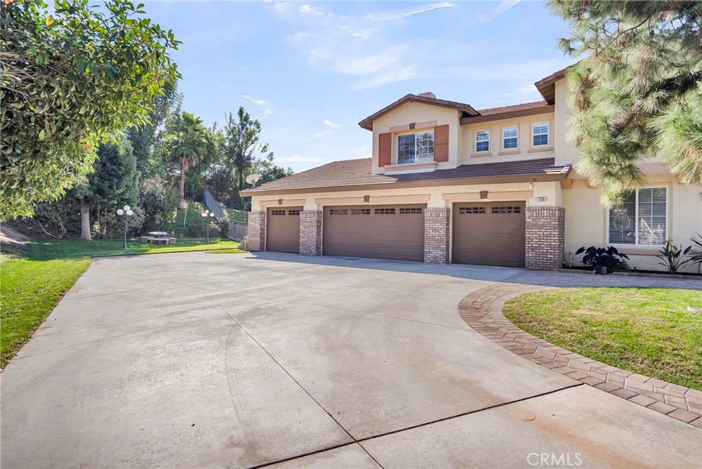 7535 Misty View Place Riverside, CA 92506 - Photo 60 of 75 a front view of house with yard and trees in the background