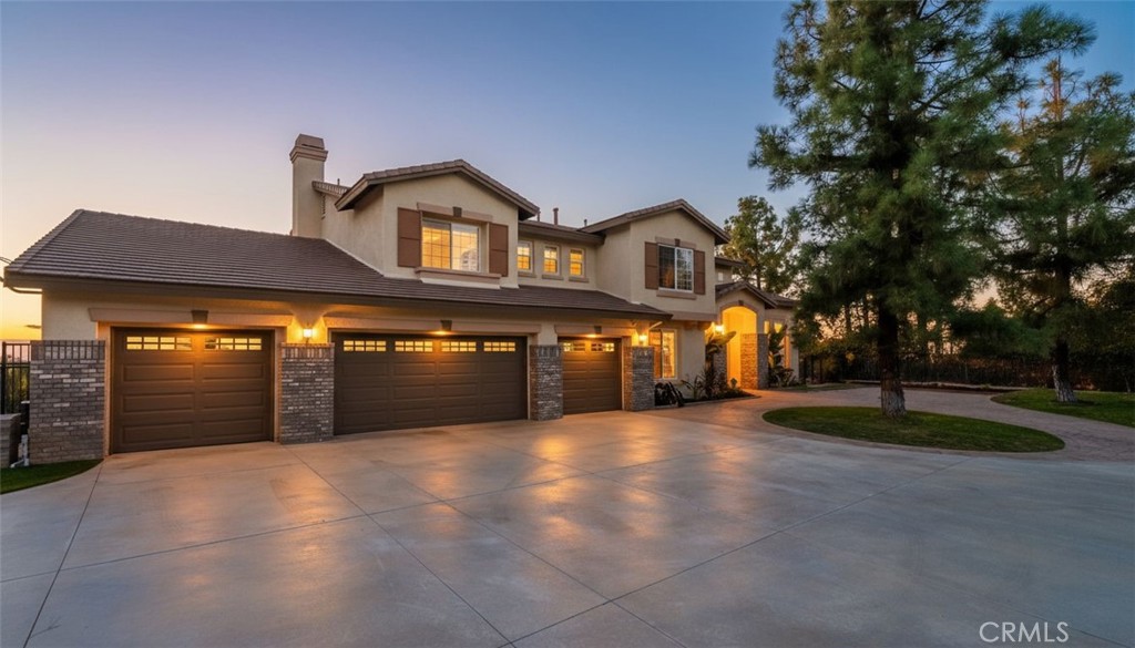 7535 Misty View Place Riverside, CA 92506 - Photo 6 of 75 a front view of a house with a yard and garage